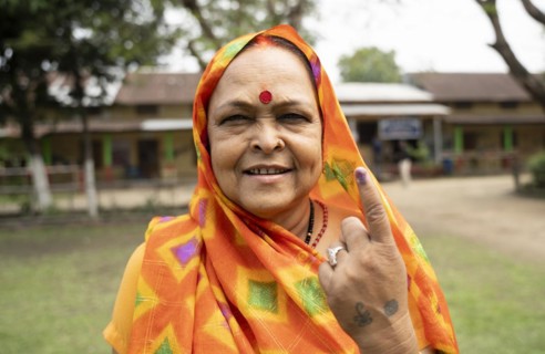 BOKAKHAT, INDIA, APRIL 19: A women show her marked finger after casting vote during the first phase