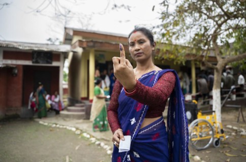 BOKAKHAT, INDIA, APRIL 19: A women show her marked finger after casting vote during the first phase