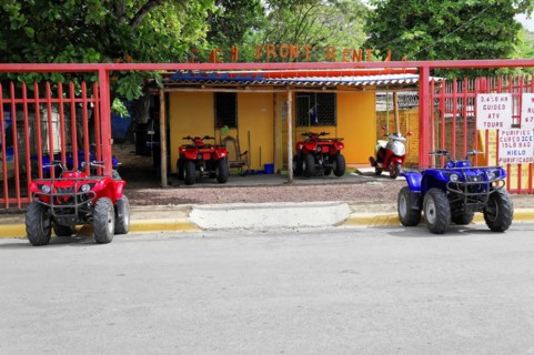 San Juan del Sur, Nicaragua, four-wheel drive vehicles for hire, parked in front of a colourful