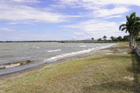 Granada, Nicaragua, A boardwalk overlooking the beach and undulating waters, Central America,