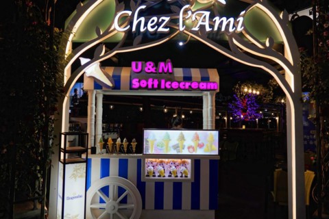 Shanghai by night, China, Asia, Illuminated ice cream van in front of a street cafe in the city at