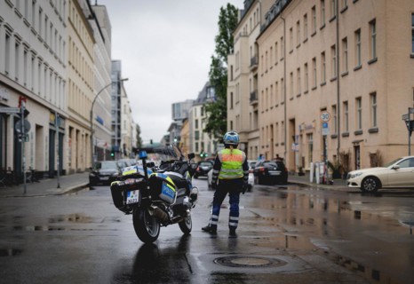 Policewoman with motorbike blocks road, taken during a demonstration in Berlin, 19/04/2024