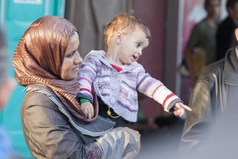 Syrian refugees have arrived at Schoenefeld station on a special train. They are then taken by bus