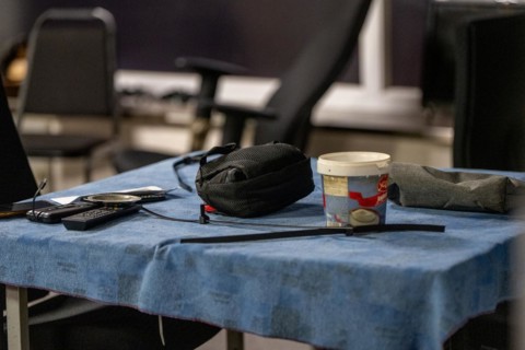A table with personal belongings and a disposable coffee cup, Cologne police led a raid against