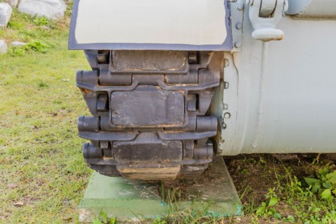 Closeup of metal tracks on military tank at public military history park in Nonsan, South Korea,