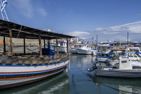 Boats anchoring in Kolona harbour in front of the city wall, Rhodes, Dodecanese archipelago, Greek