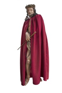Life-size, carved figure of Jesus with a red cloak on a white background, 350-year-old processional