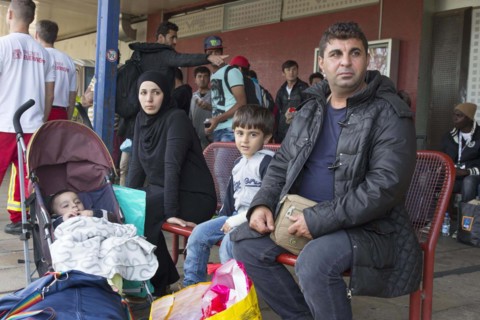 Syrian refugees have arrived at Schoenefeld station on a special train. They are then taken by bus