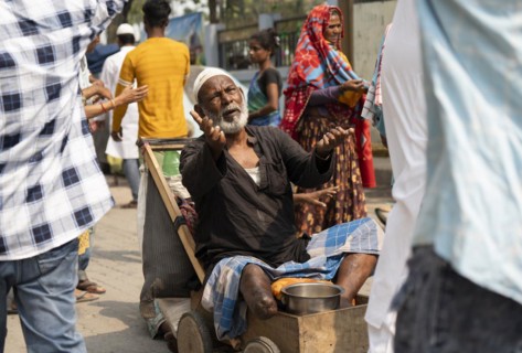 GUWAHATI, INDIA, APRIL 11: A beggar asking for money during Eid al-Fitr in Guwahati, India on April