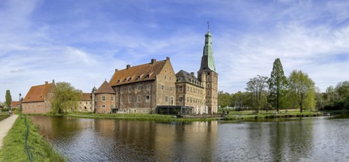 Panoramic photo View over moat to historic moated castle from Renaissance Raesfeld Castle reflected