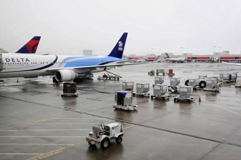 AUGUSTO C. SANDINO AIRPORT, Managua, Nicaragua, A Delta Airlines plane parked at the wet airport