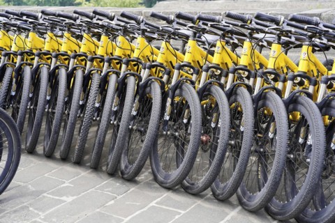Xian, Shaanxi, China, Asia, Many yellow bicycles parked in a row on a city pavement, Asia