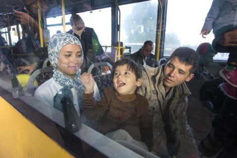Syrian refugees have arrived at Schoenefeld station on a special train. They are then taken by bus