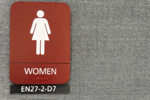 AUGUSTO C. SANDINO Airport, Managua, Nicaragua, Red sign for the woman's toilet with symbol and