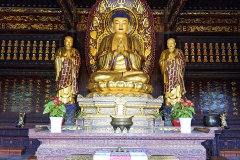 Chongqing, Chongqing Province, China, Asia, Symmetrical arrangement of golden Buddha statues inside