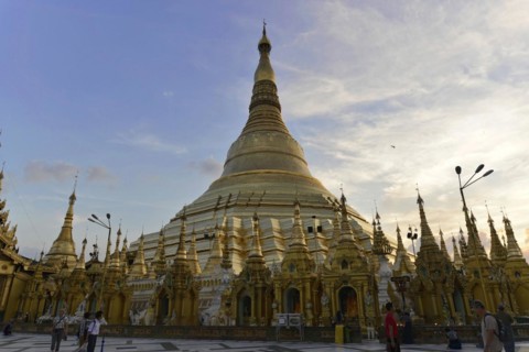 Shwedagon Pagoda, Yangon, Myanmar, Asia, Visitors in the light of the sunset at the Shwedagon