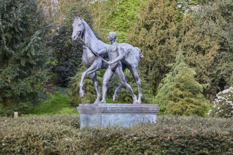 Bronze sculpture The Horse Steer by the sculptor Louis Tuaillon in the Wallanlagen Park in Bremen,