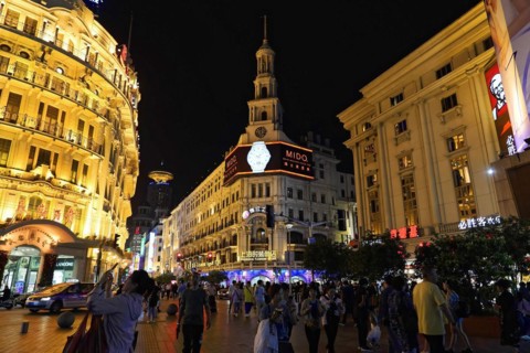 Evening stroll through Shanghai to the sights, Shanghai, Night-time street with brightly lit