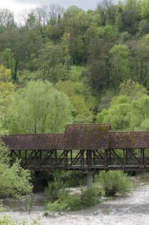 Spring awakening in the Kocher valley near Schwaebisch Hall, wooden bridge, hillside forest,