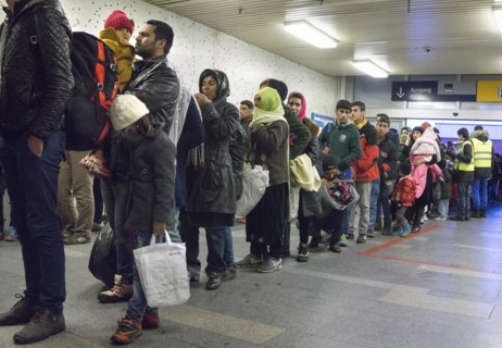 Refugees have arrived at Schoenefeld station on an IC train. They are then taken by bus to