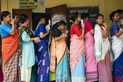 BOKAKHAT, INDIA, APRIL 19: Voters wait in line at a polling station to cast their votes during the