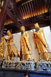 Jade Buddha Temple, Buddha, Puxi, Shanghai, Shanghai Shi, China, Three golden statues in a Buddhist