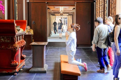 Jade Buddha Temple, Shanghai, visitors praying in a temple, traditional ambience, Shanghai, China,