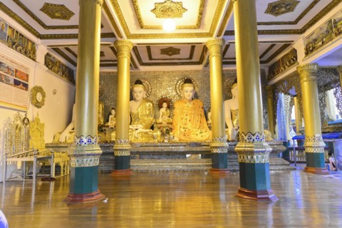 Shwedagon Pagoda, Yangon, Myanmar, Asia, Golden Buddha statues in a richly decorated interior of a