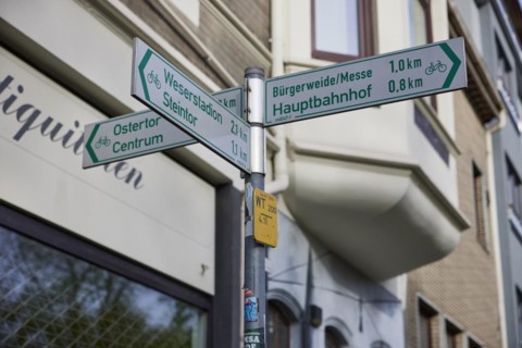 Signposts to Weserstadion, Steintor, Ostertor, Centrum, Buergerweise, Messe and central railway