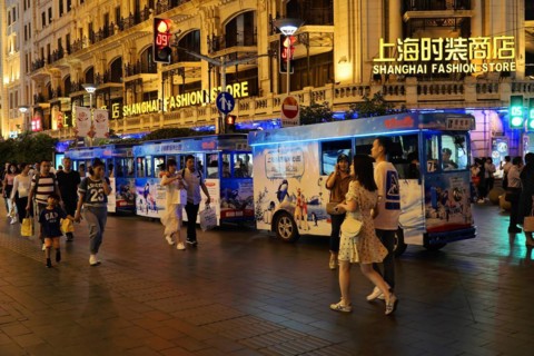 Evening stroll through Shanghai to the sights, Shanghai, Lively shopping street at night with a