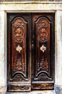 Old town alley with antique door, harbour town of Piran on the Adriatic coast with Venetian flair,