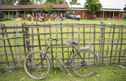 BOKAKHAT, INDIA, APRIL 19: Voters wait in line at a polling station to cast their votes during the