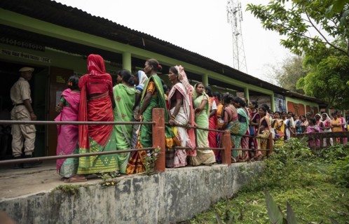 BOKAKHAT, INDIA, APRIL 19: Voters wait in line at a polling station to cast their votes during the