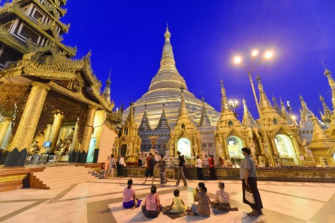 Shwedagon Pagoda, Yangon, Myanmar, Asia, Visitors at the pagoda in the evening light under a deep