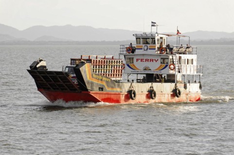 Lake Nicaragua, Ometepe Island in the background, ferry leaving a wave track on the lake, with