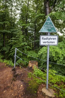 Keeping the environment clean, message to polluters and cyclists on a sign at the upper entrance to