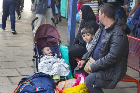 Syrian refugees have arrived at Schoenefeld station on a special train. They are then taken by bus