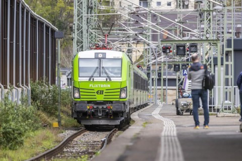 Flixtrain train at Stuttgart main station, track apron with arriving and departing trains,