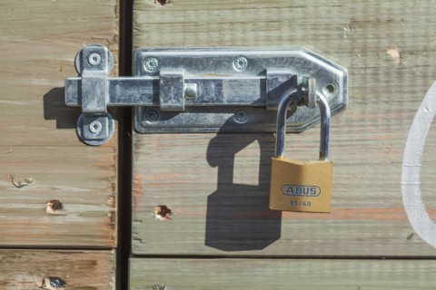 Padlock on a door bolt, Germany, Europe