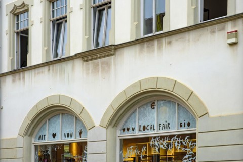 Retail shop with the shop sign Local Fair Bio on the shop window in the historic old town of