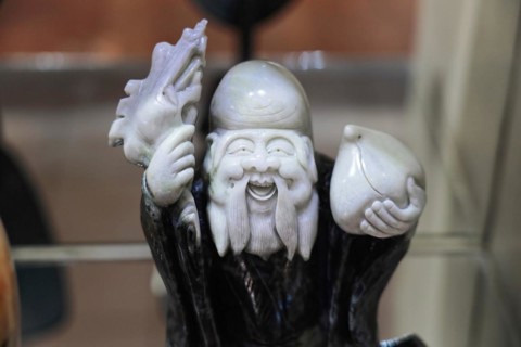 Xian, Shaanxi Province, China, Asia, Figure of an Asian wisdom character, symbolising knowledge and