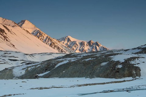 Sunrise at the snowy Cold Peak, Mongolian Chueiten, 3373m, Tavan Bogd National Park, Mongolian