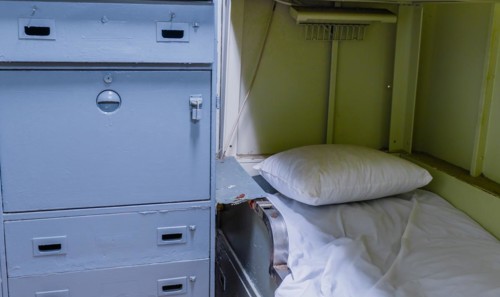Bunk bed and cabinet in sailor's cabin on board battleship at Unification Park in Gangneung, South