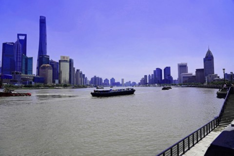 View from the Bund to the skyline at the Huangpu River with Oriental Pearl Tower, World Financial