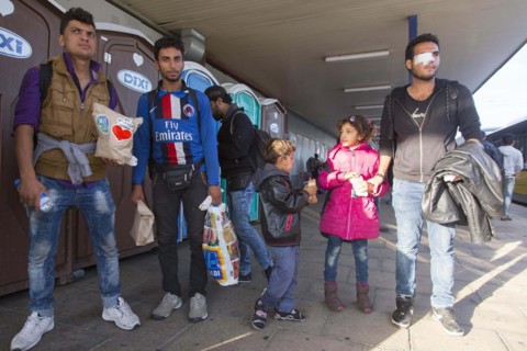 Syrian refugees have arrived at Schoenefeld station on a special train. They are then taken by bus