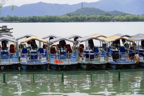 New Summer Palace, Beijing, China, Asia, Several boats on a calm lake in front of a mountain