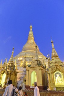 Shwedagon Pagoda, Yangon, Myanmar, Asia, People gather at the Shwedagon Pagoda as dusk colours the