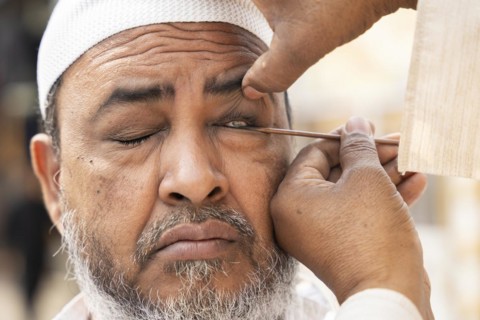 GUWAHATI, INDIA, APRIL 11: A Muslim man applies Surma on eyes during Eid Al-Fitr in Guwahati, India