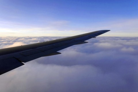 Flight to Stuttgart, Germany, view of an aeroplane wing above the cloud cover in daylight, AUGUSTO