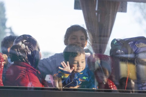 Syrian refugees have arrived at Schoenefeld station on a special train. They are then taken by bus